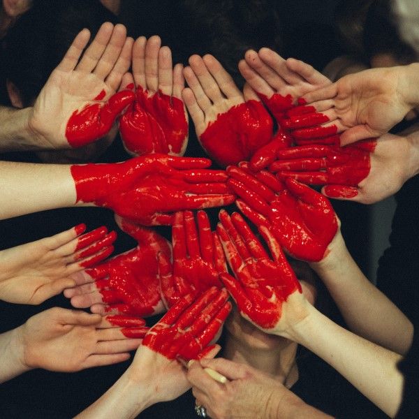 Volunteers' hands joined together